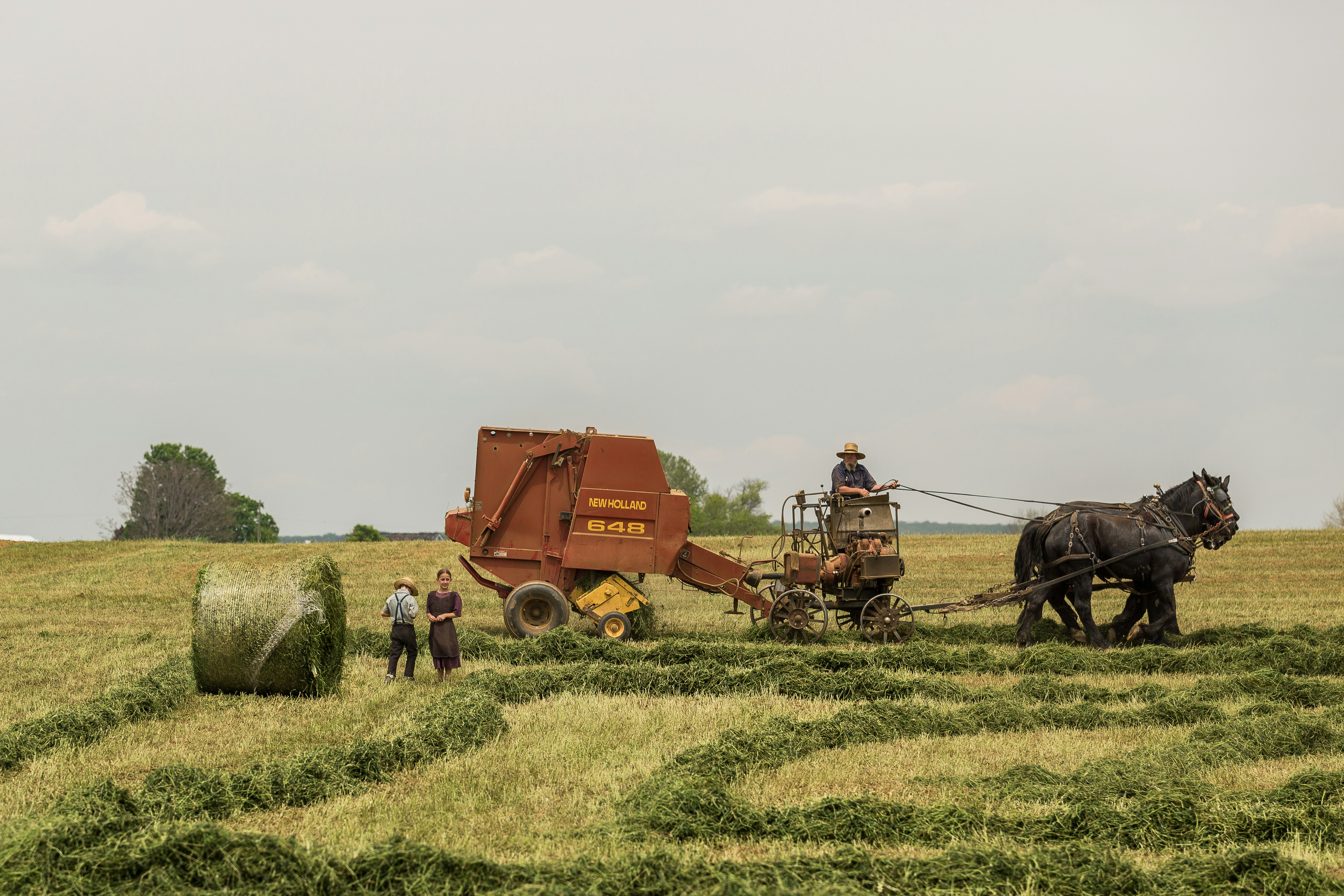 Farmers baling